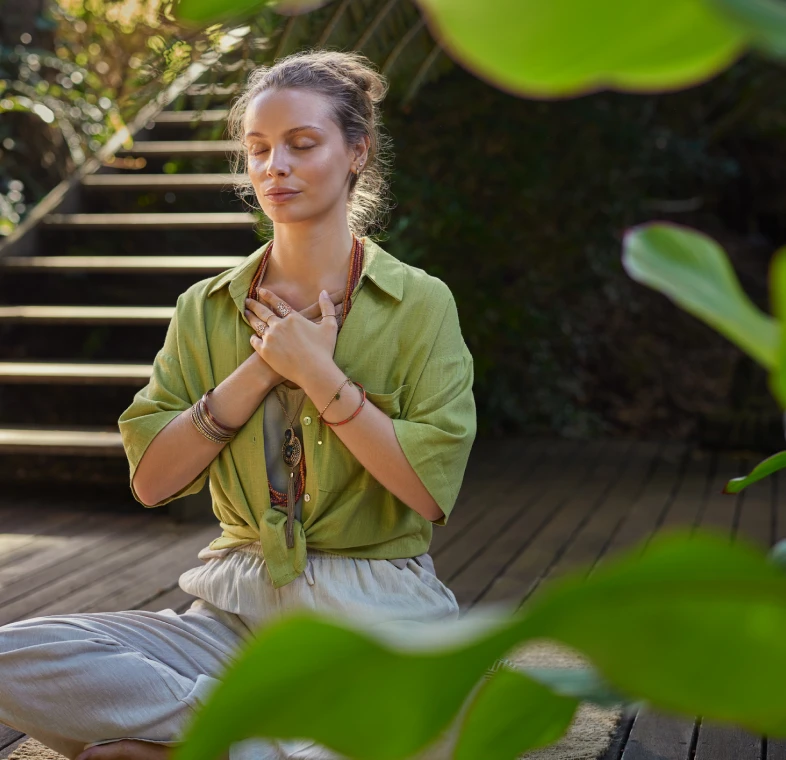 Relaxing yoga session on wooden deck