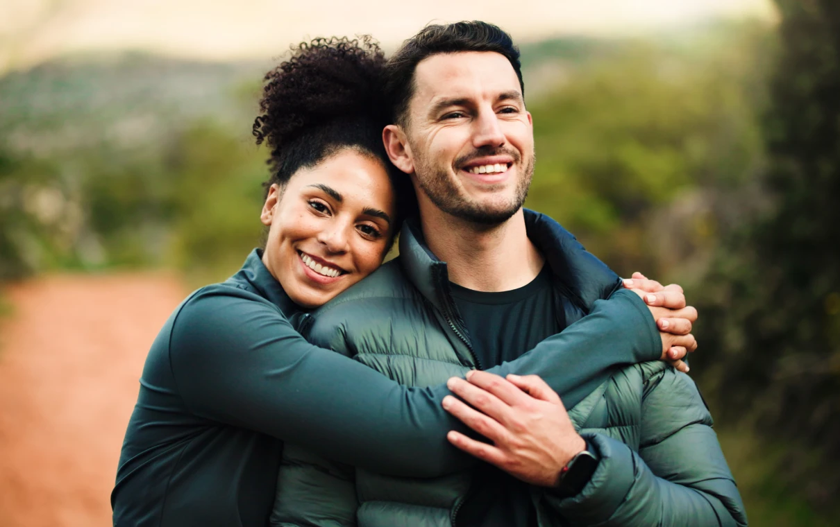 Smiling pair enjoying a scenic walk